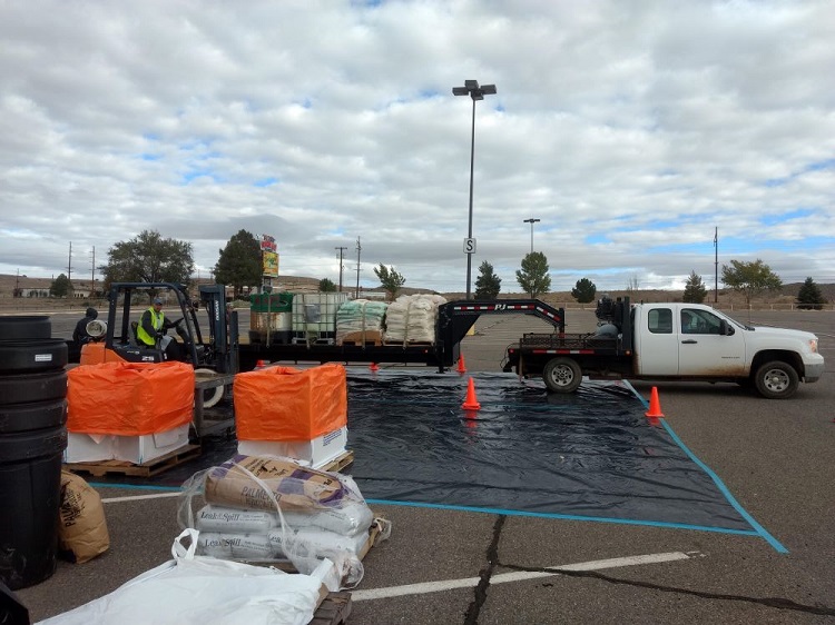 A truck and trailer being loaded by a forklift with pesticides needed to be disposed of.