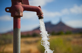 red spout with water coming out